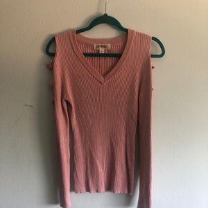 Blush pink ribbed sweater with ladder arm cutouts